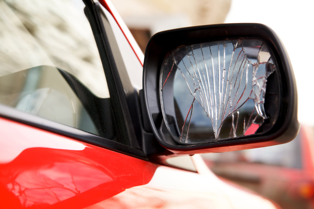 broken car side view mirror